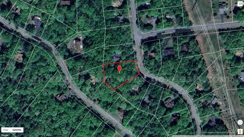 Prime Half-Acre Build Lot in Saw Creek Estates — Woods, Privacy & Resort Amenities
