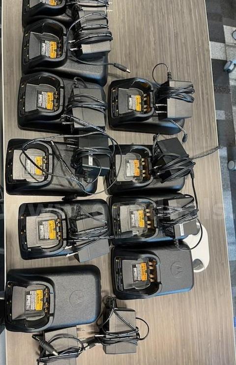 USED 11-Impress Radio Chargers with supply cords for the Motorola APX 7000 radio.