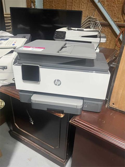 Multiple items of used office equipment.